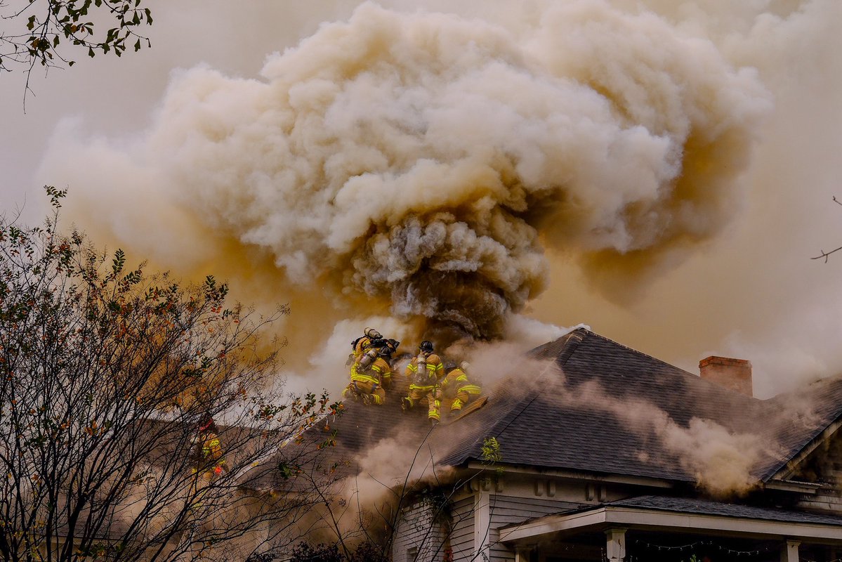 DeKalb Firefighters scaled the roof of this home in Stone Mountain and battled  flames and an overwhelming tower of smoke, saving what they could of the structure. They work to protect life and property, in that order. The homeowner escaped the blaze