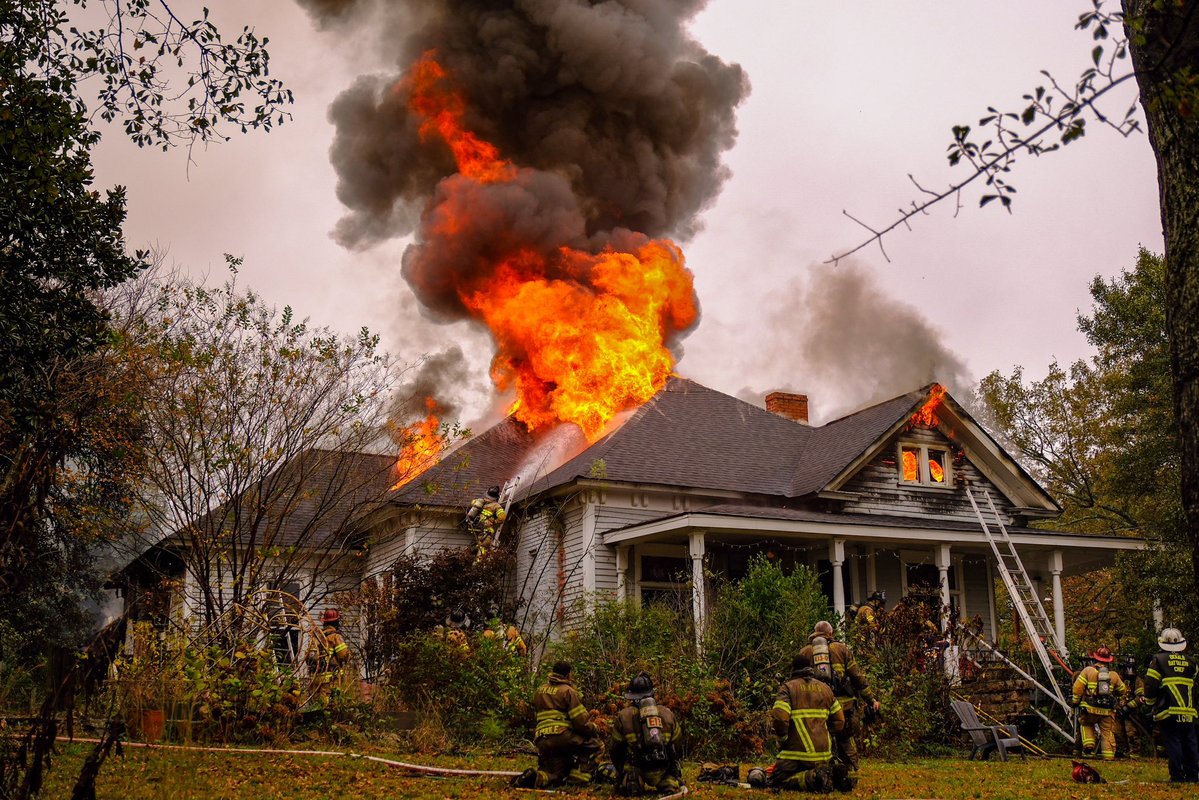 DeKalb Firefighters scaled the roof of this home in Stone Mountain and battled  flames and an overwhelming tower of smoke, saving what they could of the structure. They work to protect life and property, in that order. The homeowner escaped the blaze