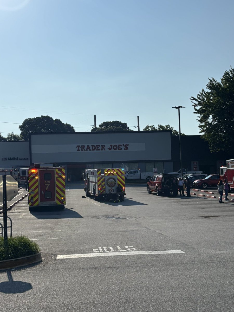 Customers outside after being evacuated from businesses. Fire crews parked outside Trader Joe’s 