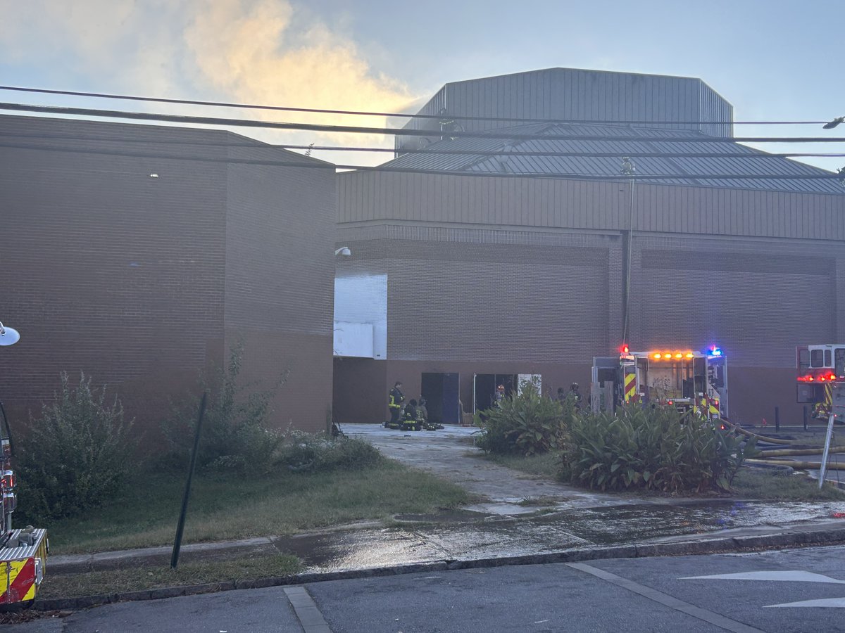 Firefighters are working to find the source of a fire at a building on the Morris Brown College campus in Atlanta
