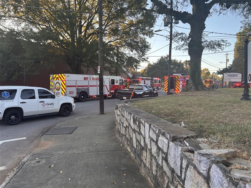 Firefighters are working to find the source of a fire at a building on the Morris Brown College campus in Atlanta
