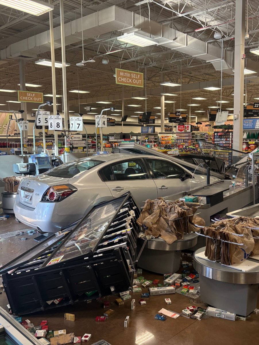 Four people were injured when a car crashed through a Kroger in Athens on Tuesday, according to police.